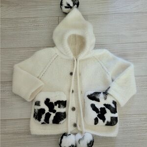Cozy White and Black Kids Hooded fluffy handmade kids jacket by Olga Herbst.
